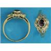 Image 1 : An 18k gold, ruby and diamond cluster ring, collet set with an oval ruby bordered by marquise and...