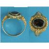 Image 1 : A Georgian design gold ring, set with an oval garnet within foliate chased bezel and shoulders, c...