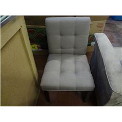 Beige Chair. Scuff on Wood Leg, Minor Brown Mark