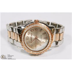 BEBE COPPER COLORED WATCH WITH MOVING GEMS IN FACE