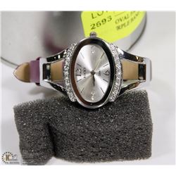 ROCKY OVAL FASHION WATCH WITH PURPLE BAND.