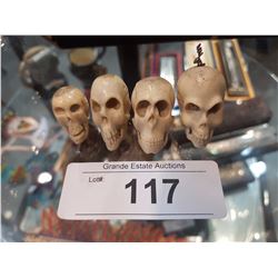 LOT OF 4 SMALL CARVED BONE SKULLS