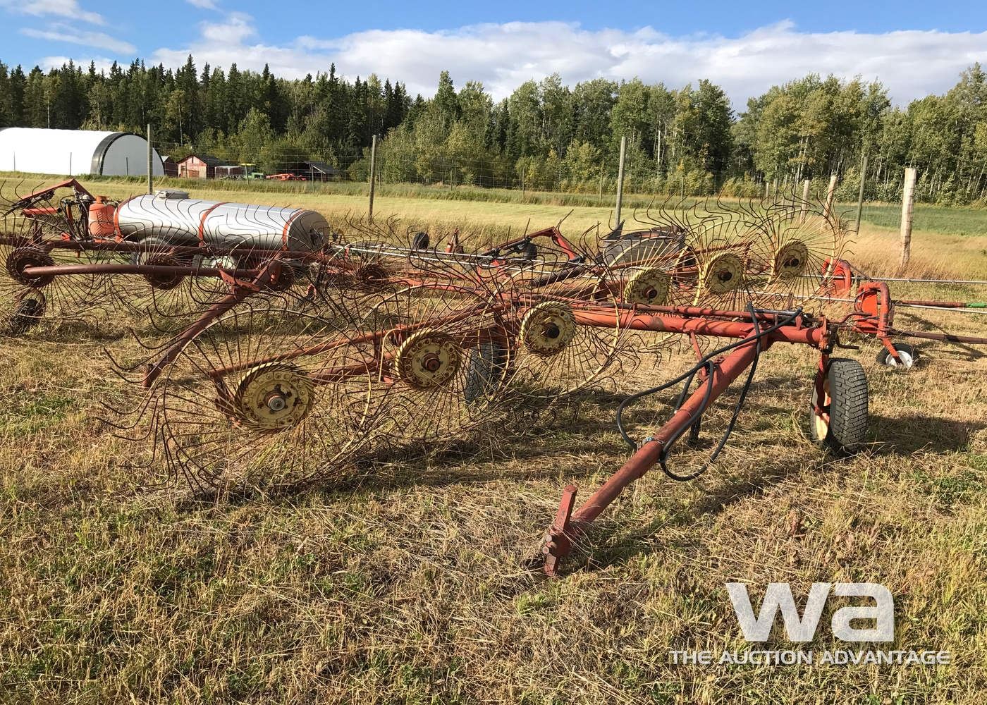 6 WHEEL HAY RAKE - Weaver Bros. Auctions Ltd.