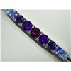 Image 2 : STERLING SILVER BANGLE WITH GARNET, AMETHYST, BLUE TOPAZ, TANZANITE AND IOLITE. APPRAISED  $450