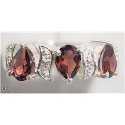 28) STERLING SILVER GARNET RING