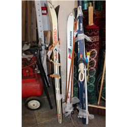 THREE SETS OF SKIIS AND POLES