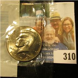 1999 P Kennedy Half Dollar in Littleton Coin Co. packaging. Gem BU.