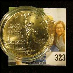 1986 P U.S. Statue of Liberty Gem BU Silver Dollar encapsulated in a cracked holder.