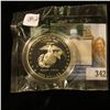 Image 2 : 2005 Marines Silver Dollar Commemorative in Littleton Coin Cellophane Holder graded CH PROOF-63. Enc
