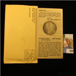 1884 O U.S. Morgan Silver Dollar in original "Tidy House Products Co….Omaha, Nebraska" holder. Super