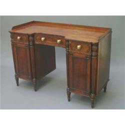 A Regency mahogany pedestal sideboard in the manner of Gillows, having three-quarter galleried ba...