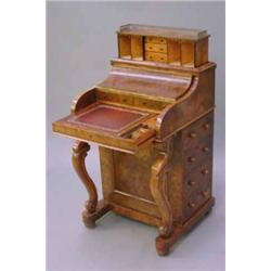 A Victorian burr-walnut piano-fronted davenport, with metamorphic stationery compartment and a fu...