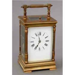 A 19th century brass repeating carriage clock, the movement striking on gong and having enamelled...