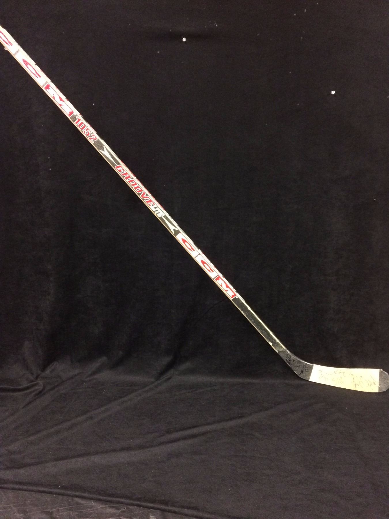 GAME USED & SIGNED HOCKEY STICK