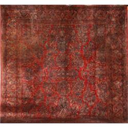 Sarouk Rug, Second Quarter 20th Century, Red ground with floral spray field within a palmette...