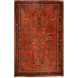 Sarouk Rug, Post 1950, Red ground with floral spray field within a rosette and trellising vin...