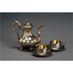 French Silver Coffeepot and a Pair of Cups and Saucers, Paris, Late 19th Century, The coffeep...