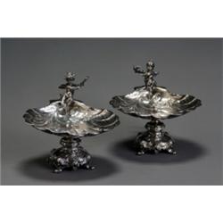 Pair of German Rococo Style Silver Figural Compotes, Circa 1900, Each having a shell-form bow...