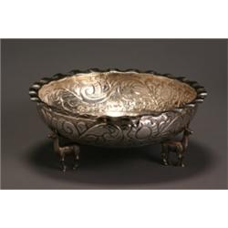 South American Silver Center Bowl, Mid-20th Century, The circular hammered-ground body chased...