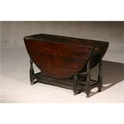 George II-III Oak Drop-Leaf Gate-Leg Table, Circa 1750-1760, Each skirt end fitted with a dra...