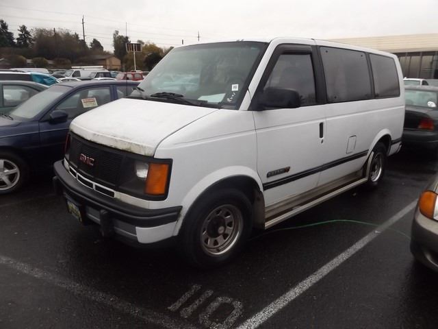 white gmc safari van