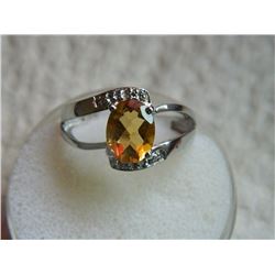 RING - OVAL FACETTED CITINE - OVER 2 CT - WITH VS CLARITY DIAMONDS IN STERLING SILVER SETTING - APPR