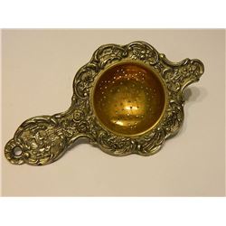 VINTAGE TEA STRAINER - MIMAGE OF COUPLE AT TABLE - small dint