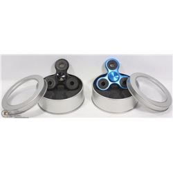 A PAIR OF NEW NITROUS SPINNERS IN METAL CASES