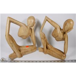 2 LIGHT WOOD SITTING PERSON ORNAMENTS