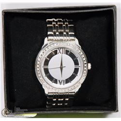 TRANSPARENT BACK SILVER TONE WATCH WITH ROMAN