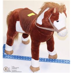 KIDS SIT ON PLAY HORSE