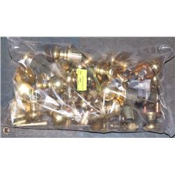 BAG OF BRASS DOOR HANDLES.
