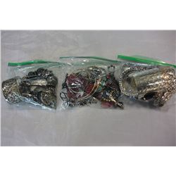 THREE SMALL BAGS OF BANGLES AND JEWELLRY