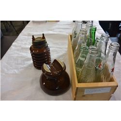 CRATE OV VINTAGE POP BOTTLES AND TWO UNUSUAL BROWN INSULATORS