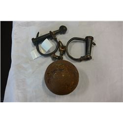 HAND CUFFS AND CAST IRON BALL