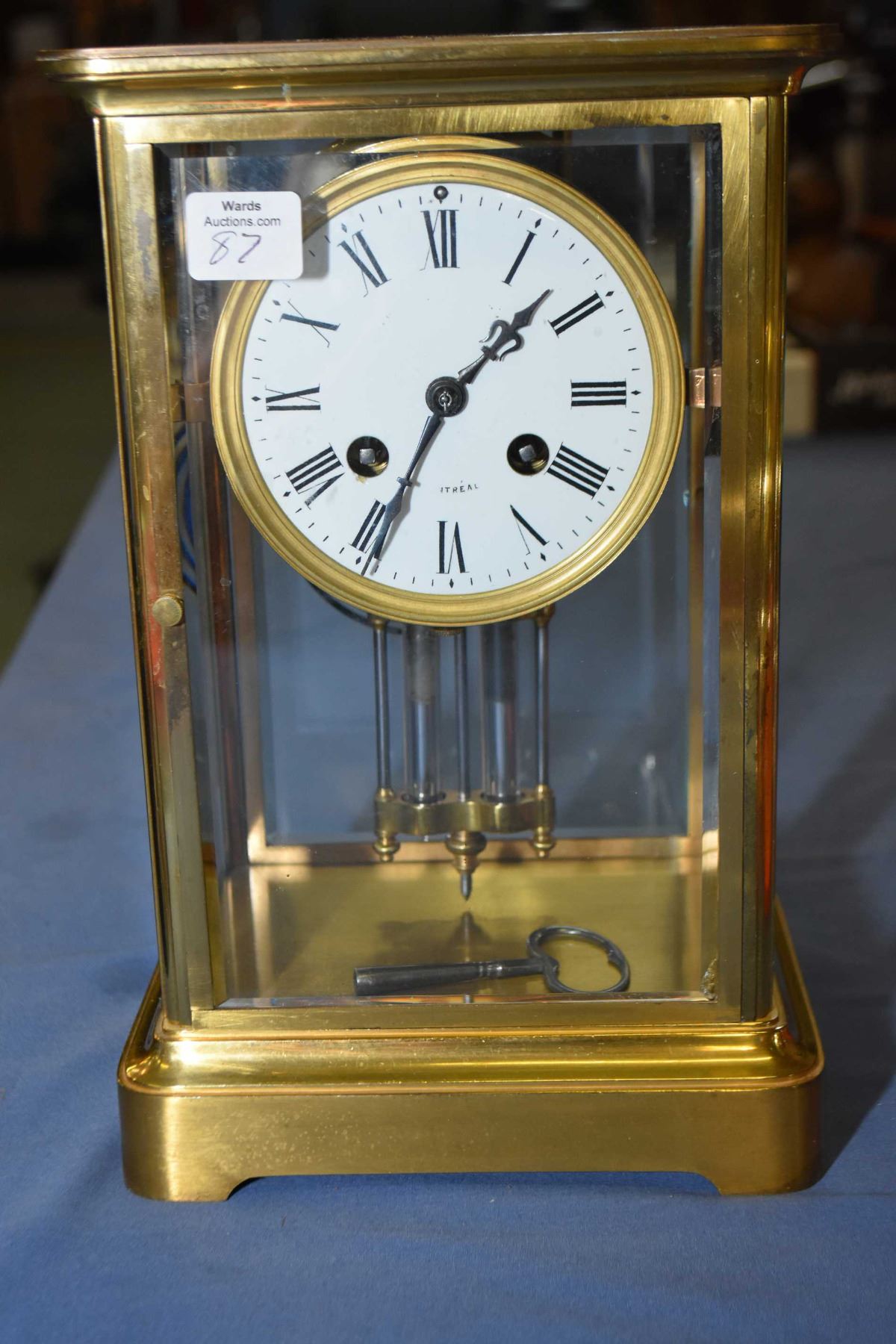 Antique brass and bevelled glass chiming mantle clock with mercury