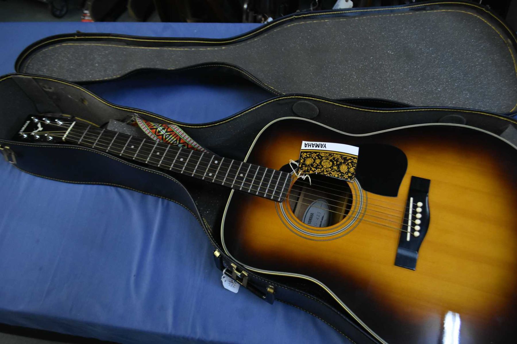 Yamaha FG425 six string acoustic guitar in hard case