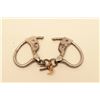 Image 1 : Tower handcuffs with key. In working order at time of