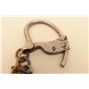 Image 4 : Tower handcuffs with key. In working order at time of