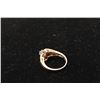 Image 2 : 14k yellow gold bypass ring set with a center diamond