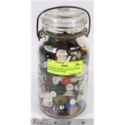 ANTIQUE QUART JAR FILLED WITH VINTAGE BUTTONS.