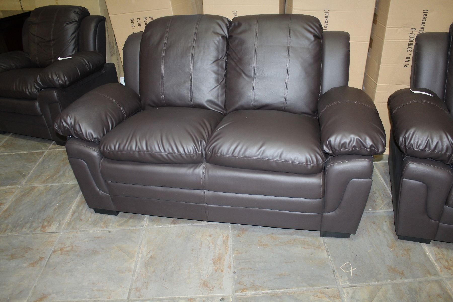 NEW BROWN LEATHER ASHLEY DESIGN SOFA AND LOVESEAT