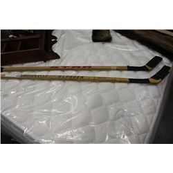 TWO VINTAGE WOOD HOCKEY STICKS