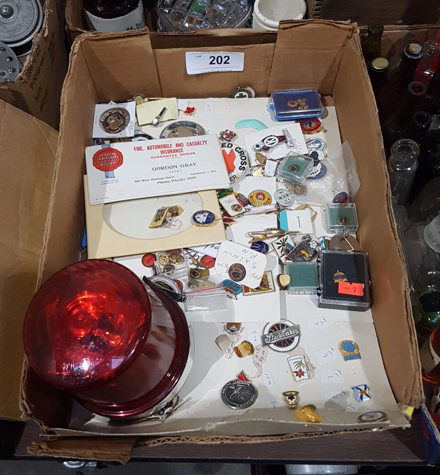 BOX LOT OF COLLECTIBLE PINS, EMERGENCY LIGHT RADIO ETC