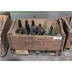 WHISTLE WOODEN POP CRATE W/MISC POP BOTTLES