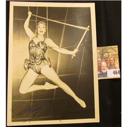 Black & White 5  x 7  photo of Betty Hutton on a trapeze. Personally autographed by Betty Hutton.