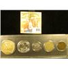 Image 2 : Snaptight case containing 1905 Indian Cent, 1910 Liberty Nickel, 1977 S Proof Dime, 1962 P Proof Was