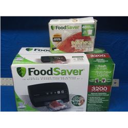 New Food Saver vacuum sealing system and box of bags