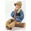 Image 1 : Doll of a seated pioneer playing a pipe, by WIZO