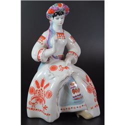 Ukranian porcelain figurine, woman embroidering